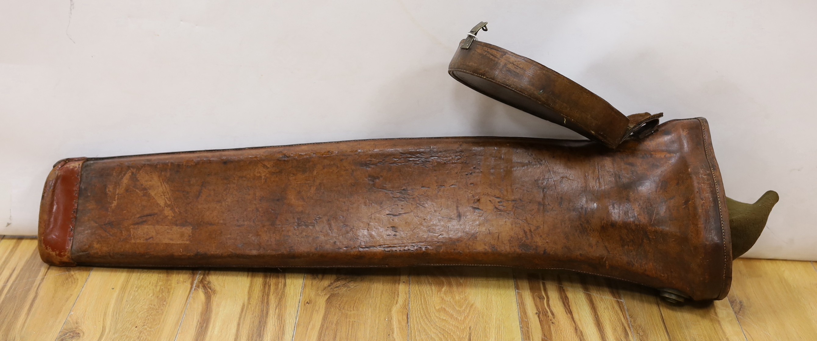 A 19th century brown leather trombone case, 103cm long